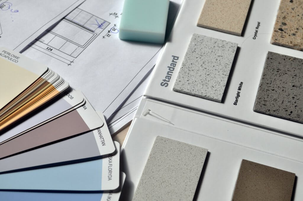 Assorted office furniture material samples and color chart laid out on a table for client selection by FIZONE OFFICE SYSTEM